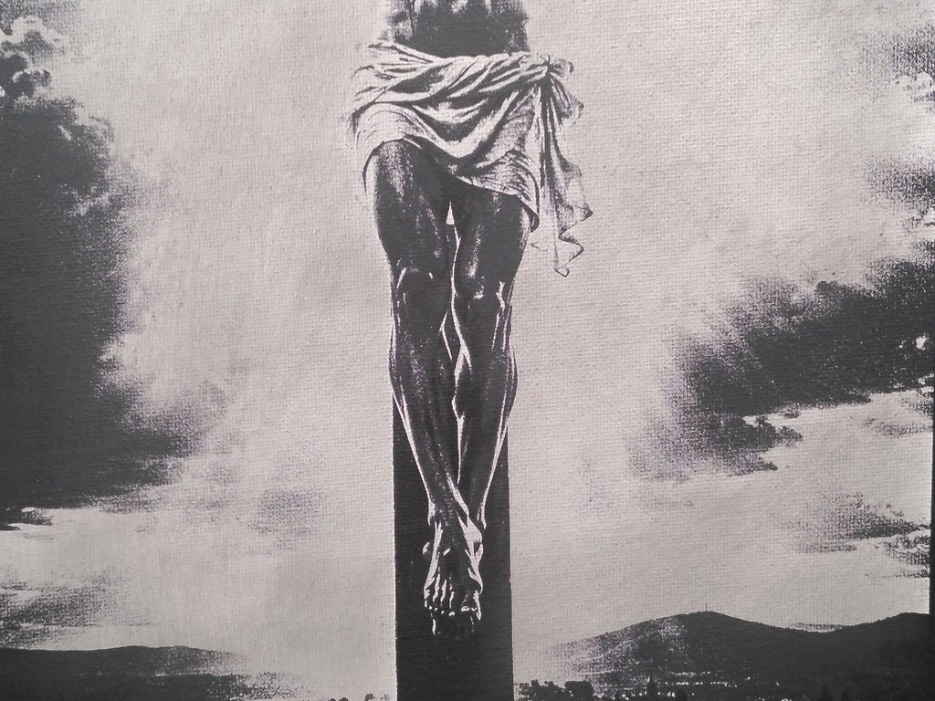 Laser-engraved, spray painted canvas board of Jesus Christ.