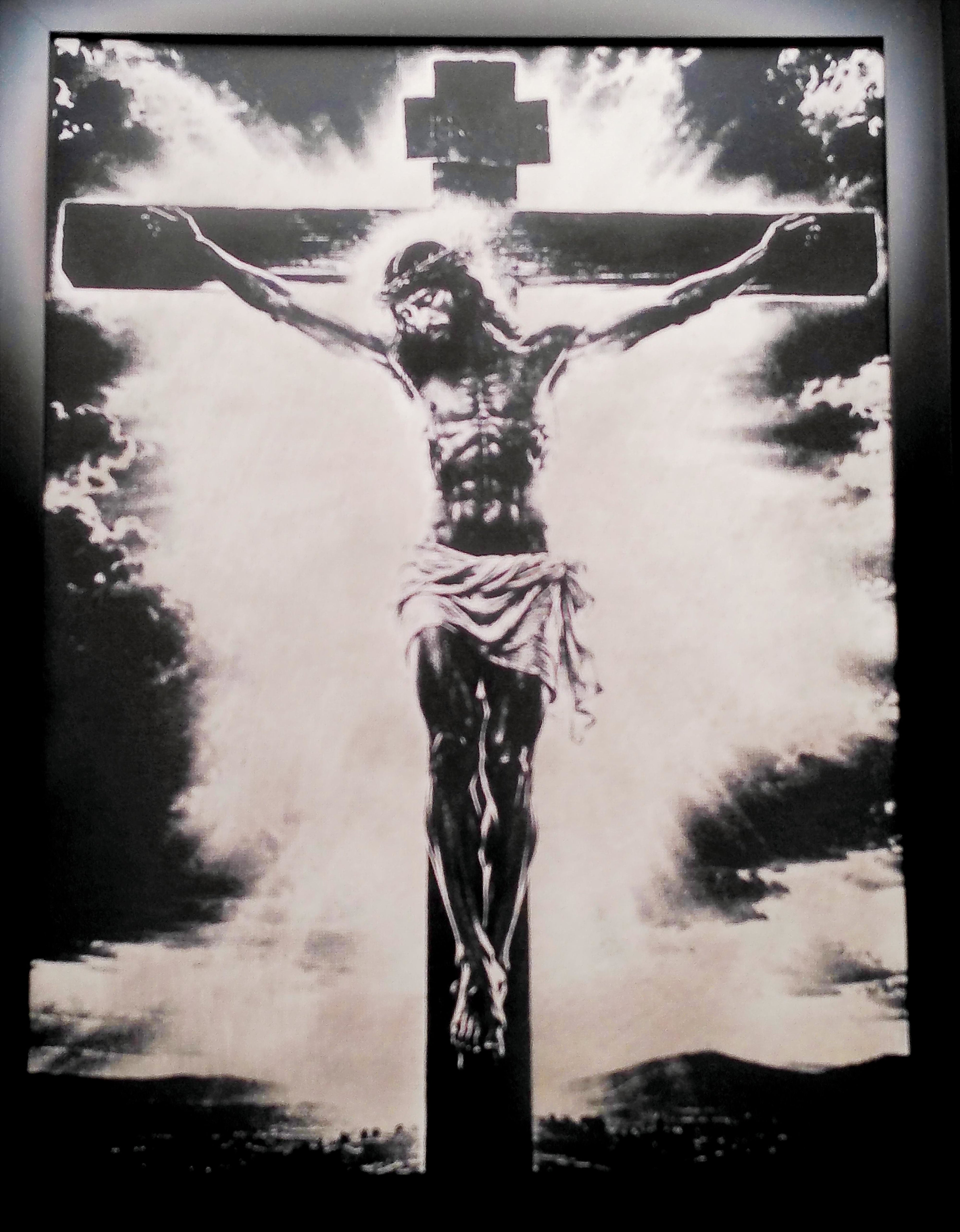 Laser-engraved, spray painted canvas board of Jesus Christ.