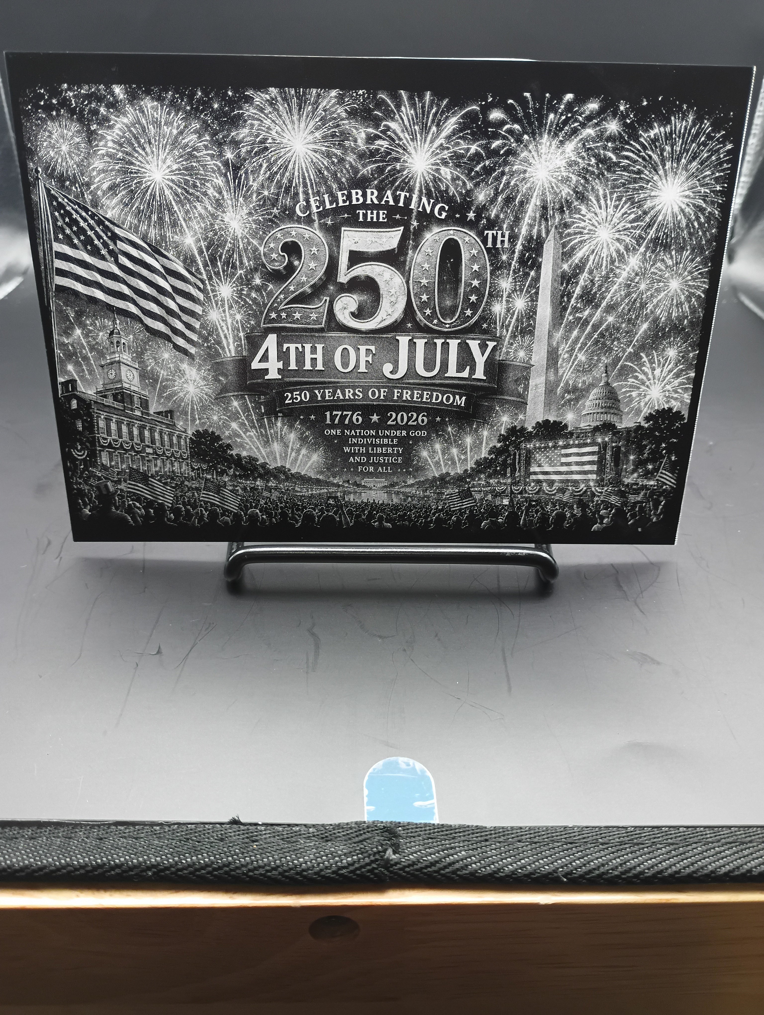 Promotional poster celebrating the 250th anniversary of the United States' independence with fireworks and American flags.