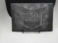 Decorative plaque celebrating the 250th anniversary of the 4th of July on a stand.