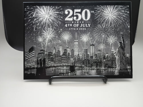Decorative plaque with fireworks and cityscape design celebrating the 250th anniversary of the 4th of July.